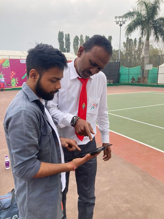 Training an official on the scoring app court-side